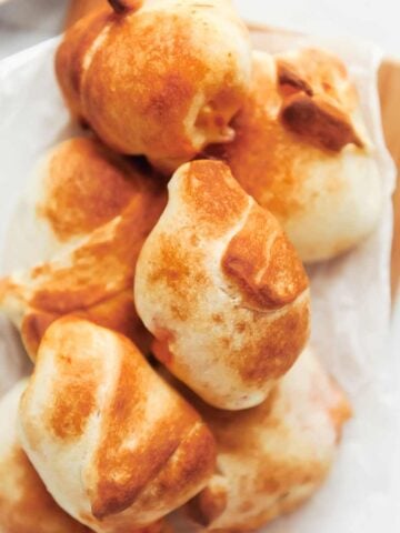 air fryer pizza rolls on a piece of parchment paper.