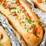 close up of a turkey baked meatball sub topped with melted cheese.