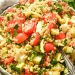 close up square image on italian caprese quinoa salad wtih tomatoes, mozzarella, and basil.
